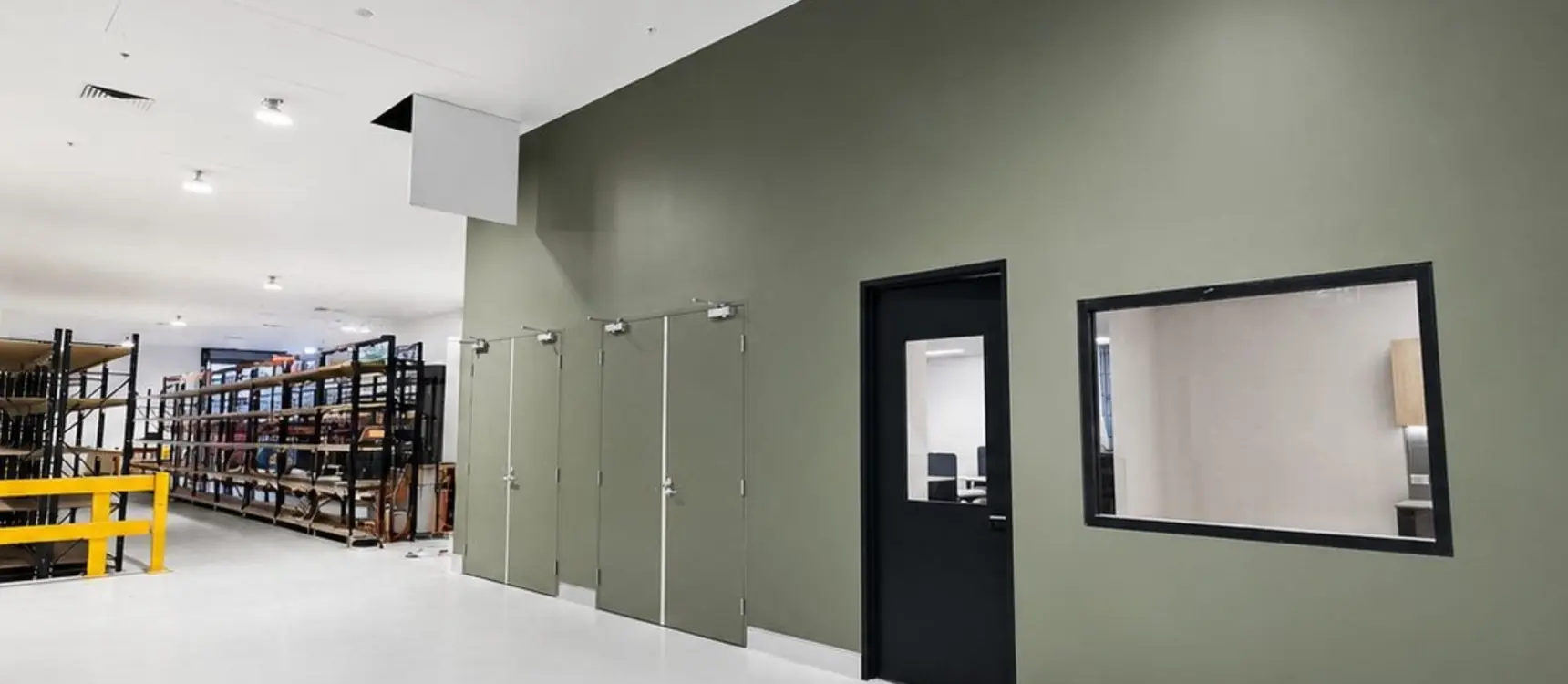 Distribution center with green feature wall and epoxy floor