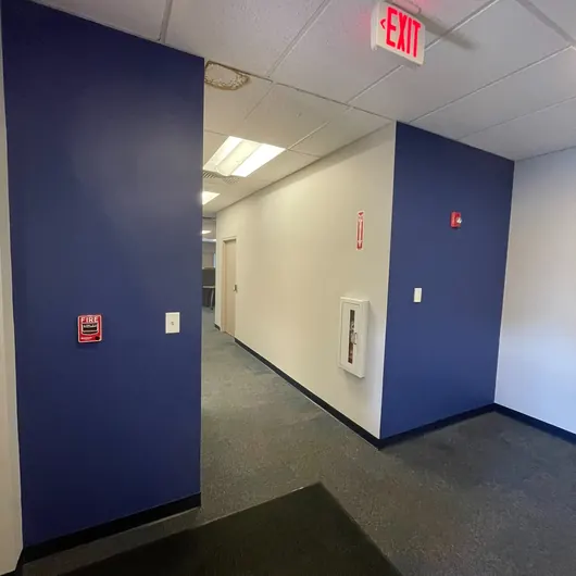 Navy accent wall in a repainted office