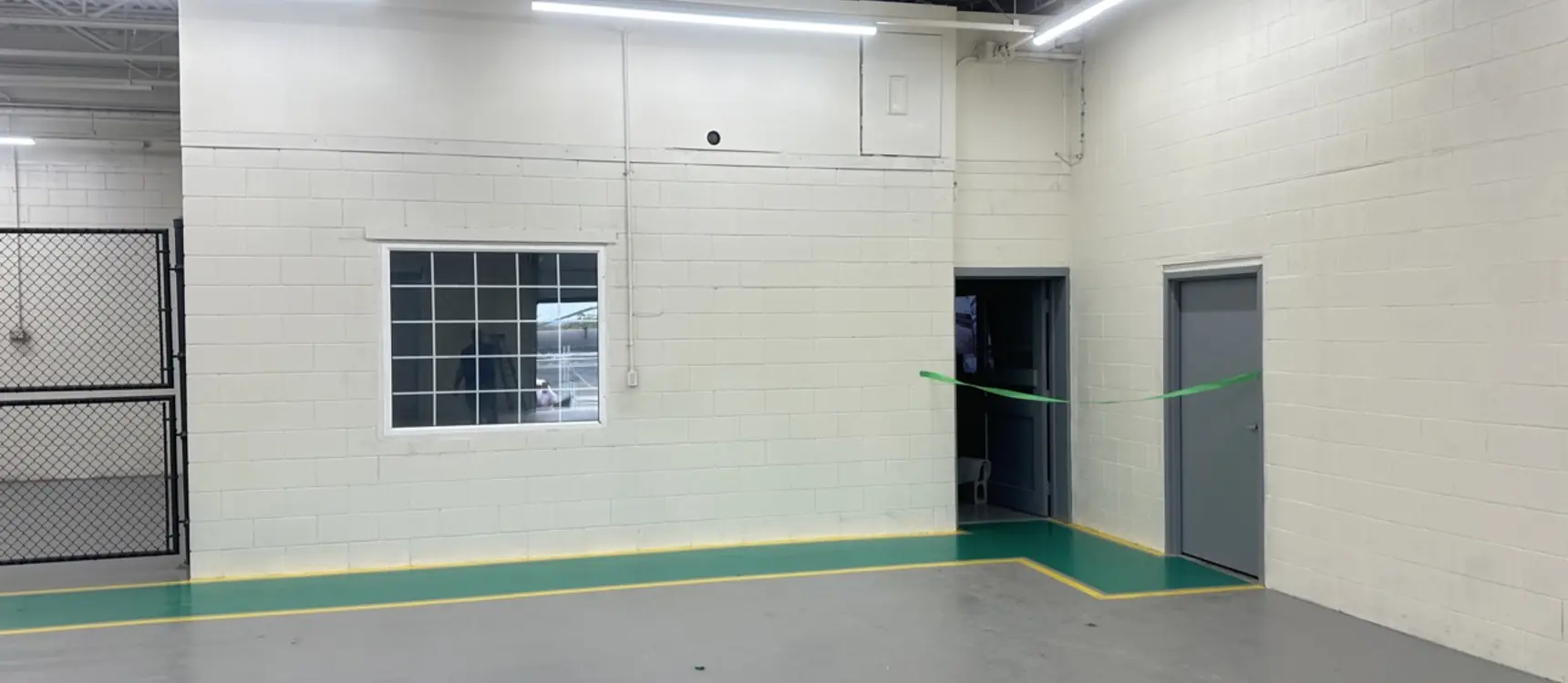 Warehouse with fresh wall paint and floor striping
